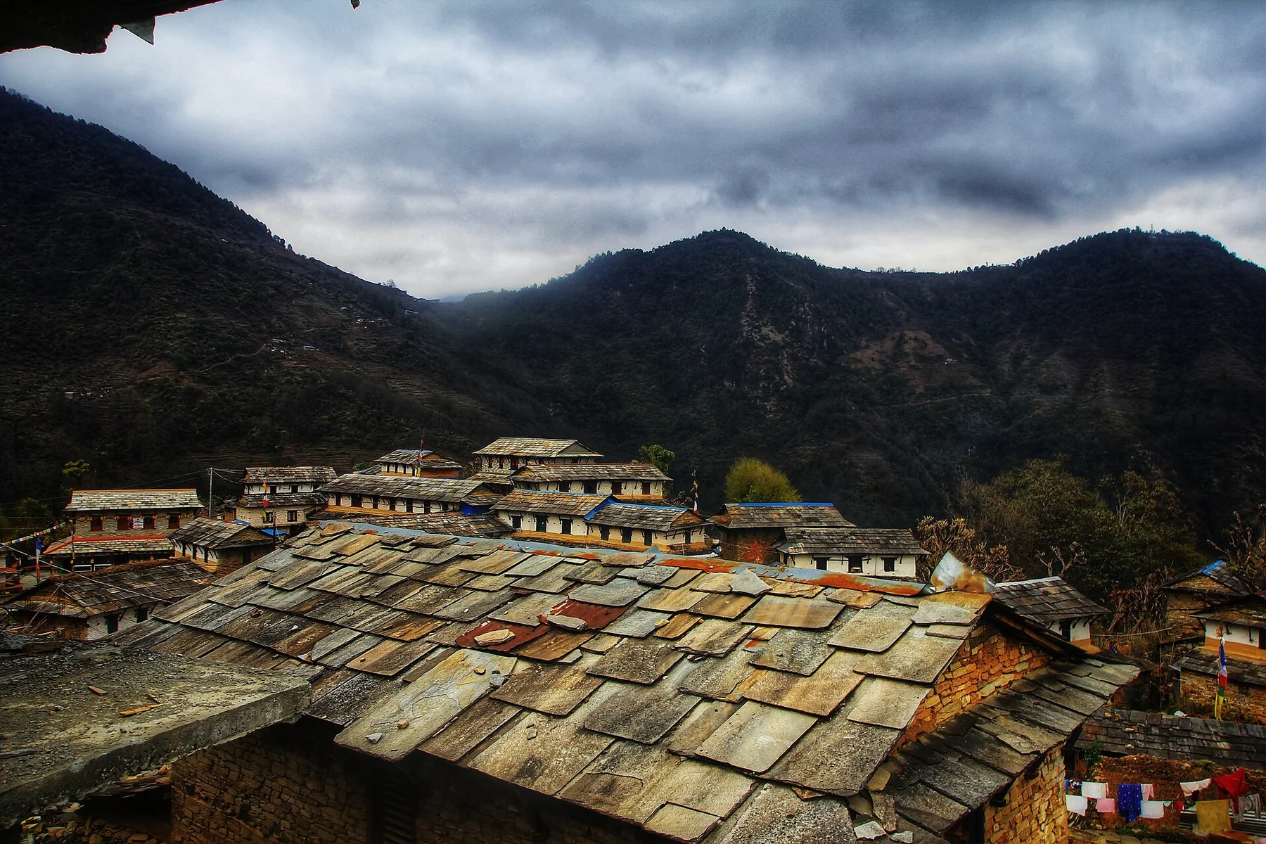 Slate rooftops and hillside buildings in Ghandruk